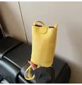Vertical mini crossbody phone bag in yellow pebbled leather with a front pocket - Without Pendant / Yellow
