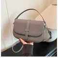 Gray textured saddle crossbody bag with metal buckle and adjustable shoulder strap - Gray / One Size