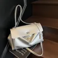 Minimalist silver metallic shoulder bag with twist lock and top handle for women - Large / Silver Large