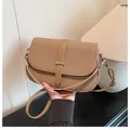 Elegant retro brown woven crossbody bag with smooth leather trim and silver metal buckle - Brown / One Size