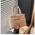 Elegant beige woven tote bag with dual handles and crossbody strap in a modern design - Beige