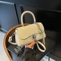 Chic cream white leatherette square handbag with silver metal twist lock and pendant - With Pendant / Off White