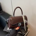 Retro chocolate brown crossbody square bag with tennis racket charm and metal lock - With Pendant / Brown