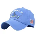 Detail of vintage washed blue cotton baseball cap with shark embroidery and US flag patch - Adjustable / Blue