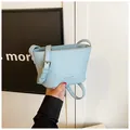 Light blue lychee pattern bucket bag with adjustable strap and silver zipper closure - One Size / Blue