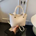 Cream white bucket bag with lychee texture and knotted handle for daily commute - No Pendant / White
