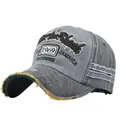 Close-up of vintage grey baseball cap with 1969 embroidery and distressed brim details - Black and Grey