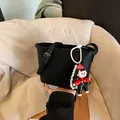 Black litchi grain bucket bag with adjustable strap and cute cartoon girl charm - With Pendant Style / Black