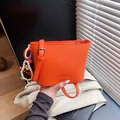 Orange bucket bag in lychee pattern leather with stylish pearl doll charm and strap - With Pendant Style / Orange
