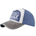 Detail of vintage distressed baseball cap with Motors Racing Team patch and frayed brim - Coffee and Navy