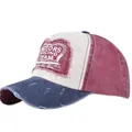 Detailed macro of vintage motors racing patch on washed distressed baseball cap - Navy Blue and Wine Red