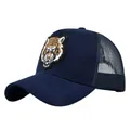 Dark blue mesh trucker hat featuring a detailed tiger head embroidery on front - Adjustable / Navy Blue