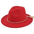Detail shot of the red felt fedora featuring a gold chain with pearls and white tassel - M / Red