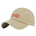Detail shot of khaki vintage dad hat with red script embroidery and curved brim - Adjustable / Off White