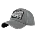 Close-up of distressed grey baseball cap with embroidered vintage fabric patch and frayed brim - Adjustable / Gray