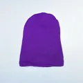 Close-up of a purple knitted beanie showing dense flat-knit texture and soft wool blend fabric - One Size / Purple