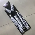 Detail of piano key pattern suspenders with silver metal clips and black leather joiner - Piano Pattern (1)