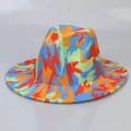 Top view of colorful tie-dye fedora hat with wide flat brim and camouflage pattern - Orange And Red