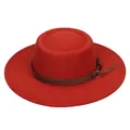 Detail of red flat-top felt hat featuring a dark brown leather band and metal ring - Brick Red