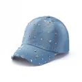 Close-up of light blue denim baseball cap with silver star studs and frayed vintage brim - Light Blue Starry Rivet