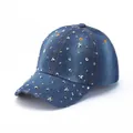 Detailed macro view of denim baseball cap with silver star studs and distressed brim - Blue Starry Rivet