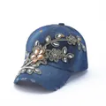 Detailed embroidery and rhinestone accents on a vintage blue denim baseball cap - Blue Gold Embroidered Floral