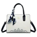 Off-white leather crossbody bag with navy embroidery and stylish handle scarf detail - White
