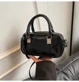 Chic black glossy Boston handbag for women with silver hardware and adjustable strap - Black without Pendant