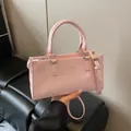 Rosa glänzende Kunstlederhandtasche mit Griffen und verstellbarem Schultergurt - Ohne Anhänger / Rosa
