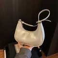Minimalist cream white crescent hobo bag in faux leather with adjustable shoulder strap - No Pendant / White