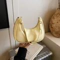 Creamy yellow faux leather underarm baguette bag with gold lettering and silver rivets - No Pendant / Yellow