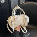 White vintage-style bowling bag with wrinkled texture and adjustable crossbody strap - No Pendant / White