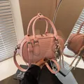 Light pink bowling style crossbody bag with soft faux leather and UOR UOR logo detail - No Pendant / Pink
