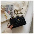 Chic black quilted mini crossbody bag with gold chain strap and floral emblem - Large / Black