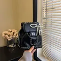 Mini black glossy leather backpack with silver chain and elegant pearl bow charm - With Pendant / Black