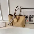 Large beige frosted tote bag with diamond quilting and lettered strap detail - Light Khaki