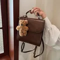 Zaino vintage in ecopelle marrone scuro con ciondolo a orsetto multifunzionale - Con Ciondolo / caffè