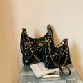 Ensemble de deux sacs de selle matelassés noirs avec chaînes dorées sur valise - Petit / Noir