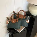 Dark green nylon tote bag set with brown leather handles and decorative horse charm - Small With Charm / Green
