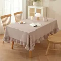 Brown and white plaid cotton tablecloth with ruffled edges on a wooden dining table - Ruffle Style / 132cm x 178cm / Coffee Plaid