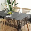 Detailed view of white eyelash lace border on vintage Nordic style tablecloth fabric - Black Eyelash Lace