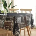 Close-up of black floral lace tablecloth with elegant eyelash fringe on wood table - 145*200cm / Black Eyelash