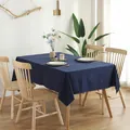 Detail of navy blue solid cotton tablecloth featuring fine edge stitching and Nordic style - Navy Blue