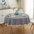 Detailed close-up of a round tablecloth with blue wave pattern and white tassel fringe - Blue White Wave