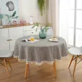 Detail of grey checkered round tablecloth with white tassel edge on wooden table - Gray Fine Check