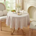 Detail of round beige tablecloth with white grid patterns and fringe tassels in retro style - Embroidered Coffee Full Grid