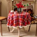Detail shot of red plaid Christmas tablecloth featuring white fringe tassel edges - 150cm / Christmas Red Plaid with Tassels