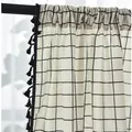 Detail of grey geometric linen curtain featuring black tassel trim and rod pocket header - 150 Wide * 220 High / White Black Grid - Rod Pocket