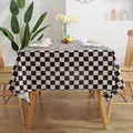 Classic black and white checkered tablecloth on a wooden table in a cozy home setting - 60*60cm / Black and White Plaid