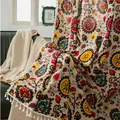 Bohemian sunflower pattern cotton linen throw with white tassel fringe on green leather sofa - Sun Flower Hook